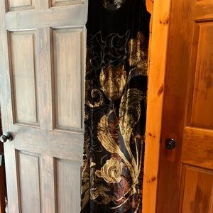 Black, gold, and copper silk floor length dress and jacket.